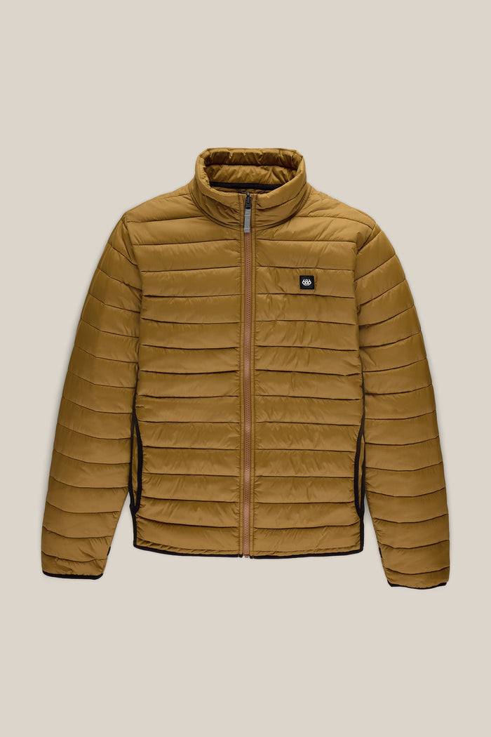 686 Menβs Thermal Puff Jacket by 686, featuring a brown color with horizontal quilting, front zipper closure, high collar, and a small black logo patch on the left chest, shown against a beige background.