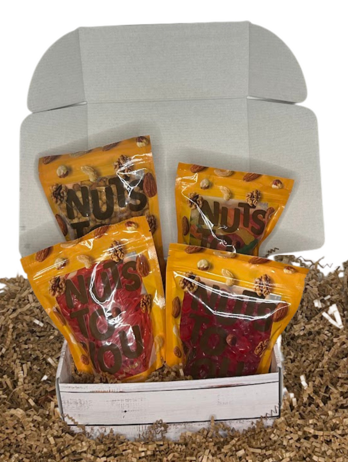 All the Sweets Gift Box which includes Strawberry laces, wild cherry gummy bears, large assorted Swedish fish, and honey roasted peanuts