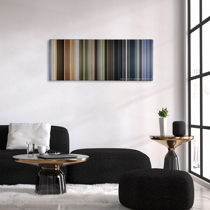 City of God color palette canvas above a black sofa with a gold-topped table