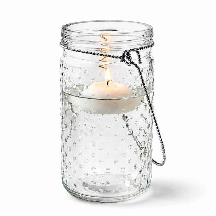 7.5" Hanging Dotted Glass Jar with Handle and lit candle