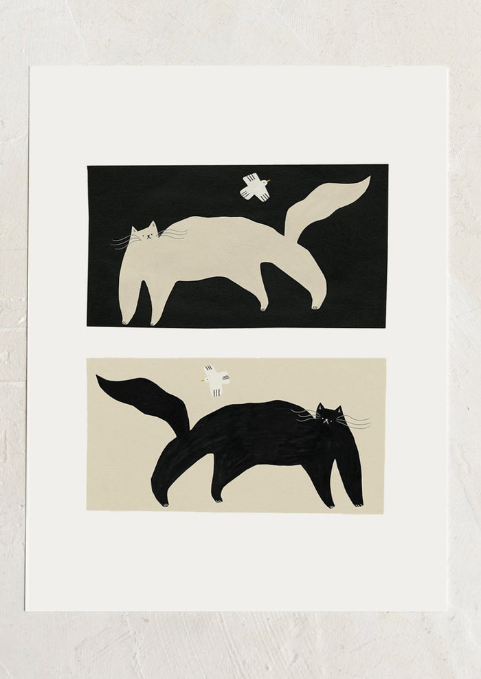 An art print with two abstract cat illustrations in inverse black and white on a white background.