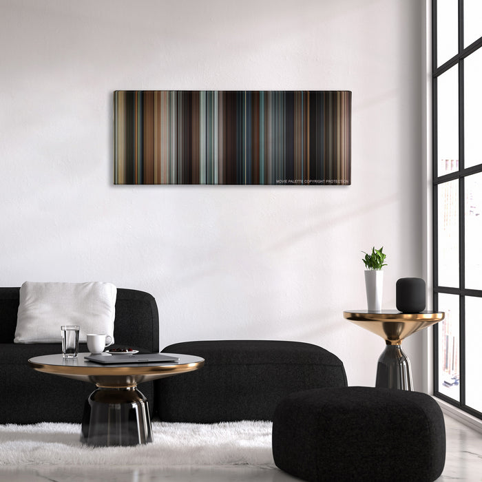 Taken color palette canvas above a black sofa with a gold-topped table