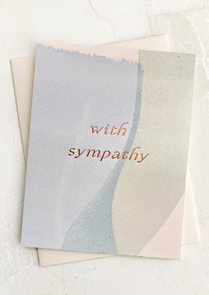 Greeting card with 'with sympathy' text on a watercolor background.