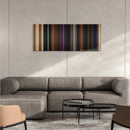 Beauty and the Beast color palette canvas on a concrete wall above a gray sectional sofa