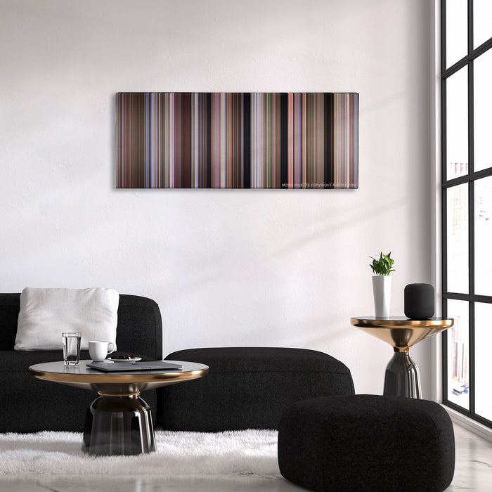 Dr. No color palette canvas above a black sofa with a gold-topped table