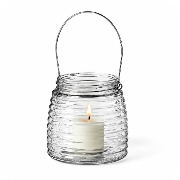 Lit white votive candle in a 4.6" Hanging Horizontal Ribbed Glass Jar with Handle