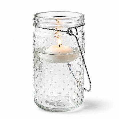 7.5" Hanging Dotted Glass Jar with Handle and lit candle