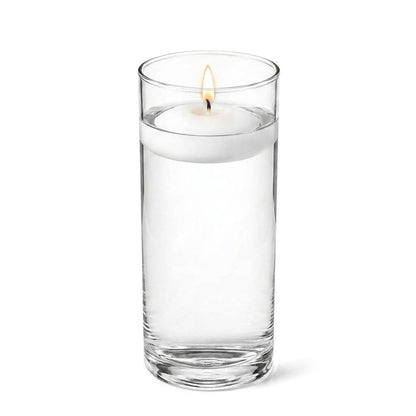 Clear 3.25"x9" cylinder vase with a lit floating candle