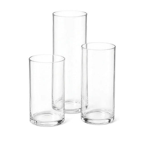 Three clear glass cylinder vases of varying heights