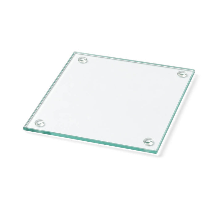 A simple clear glass Square Coaster 4" isolated on a clean white surface