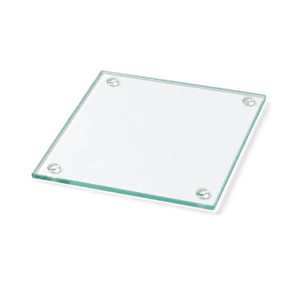 A simple clear glass Square Coaster 4" isolated on a clean white surface