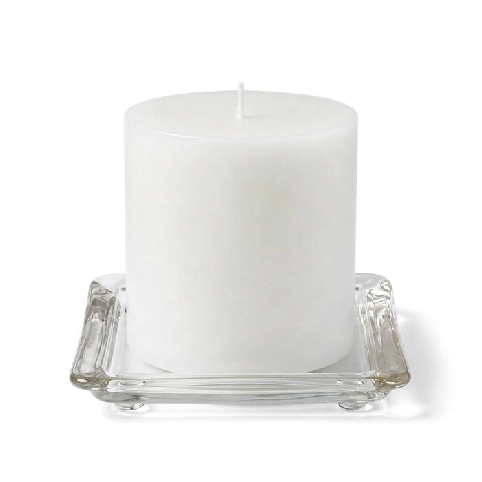 5" square glass pillar plate with a white candle on a white background