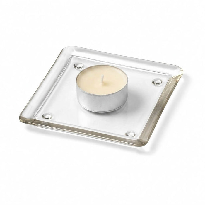 Small square glass plate with a tea light candle