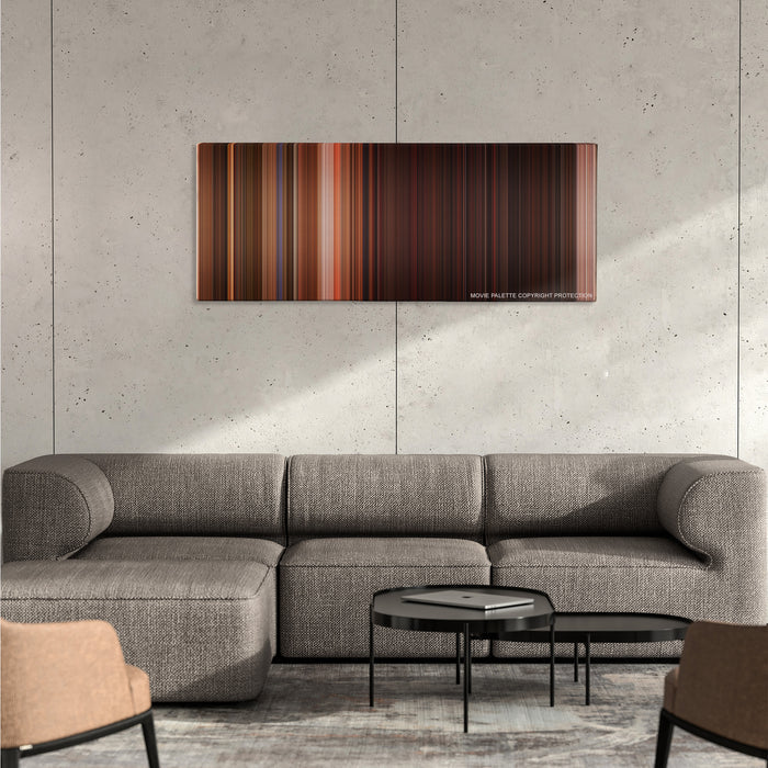 From Dusk Till Dawn color palette canvas on a concrete wall above a gray sectional sofa
