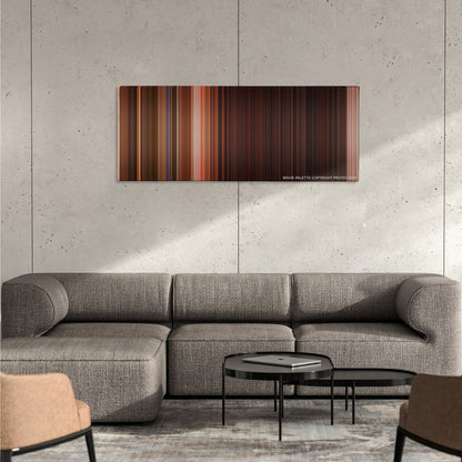 From Dusk Till Dawn color palette canvas on a concrete wall above a gray sectional sofa