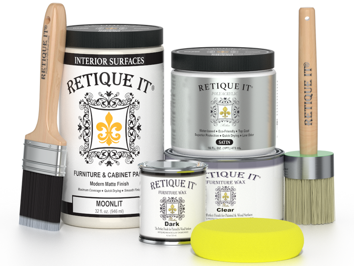 Retique It furniture wax and finish products with brushes and a sponge on a white background