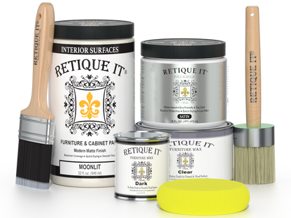 Retique It furniture wax and finish products with brushes and a sponge on a white background