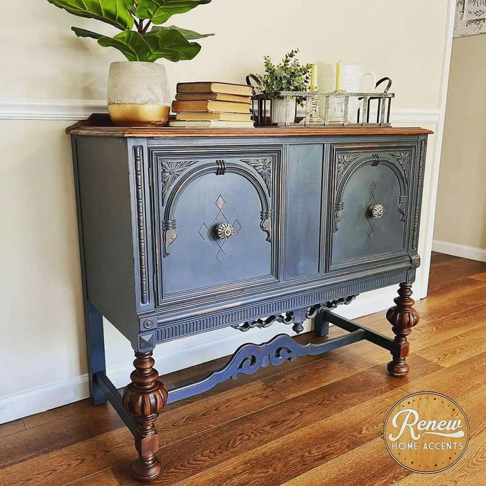 Retique It Gothic Grey furniture and cabinet paint in a quart, shown on a buffet for a stylish, modern finish.