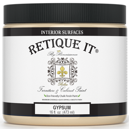 Retique It furniture and cabinet paint in a quart container, designed for gypsum surfaces, shown in a natural setting.