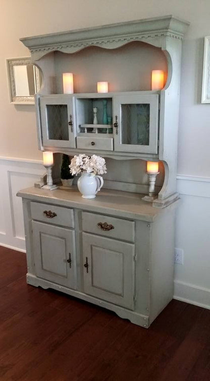 Retique It furniture and cabinet paint in Old Linen color, showing a quart-sized container with painted furniture surface.