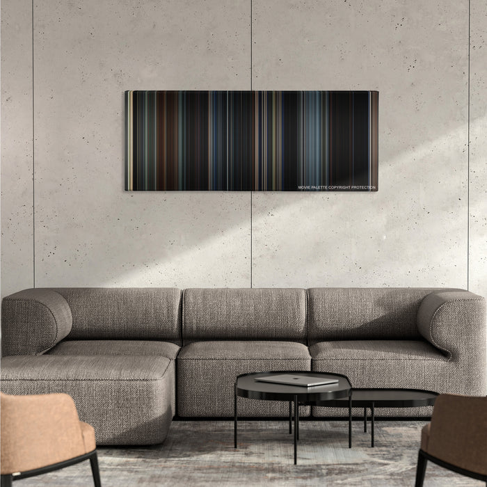 Godzilla color palette canvas on a concrete wall above a gray sectional sofa