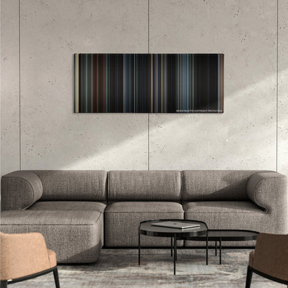 Godzilla color palette canvas on a concrete wall above a gray sectional sofa