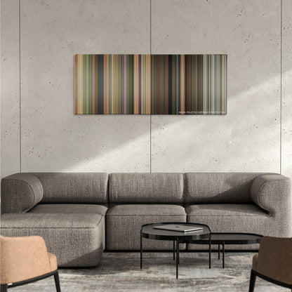 Hairspray color palette canvas on a concrete wall above a gray sectional sofa