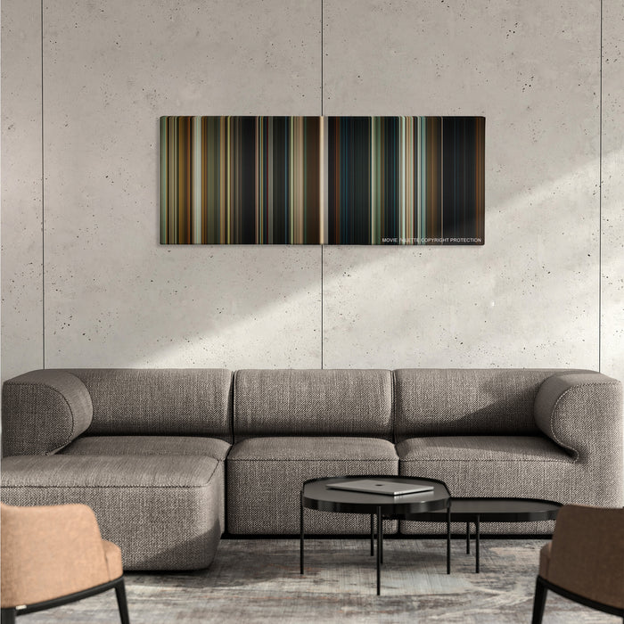 Hereditary color palette canvas on a concrete wall above a gray sectional sofa
