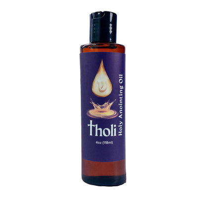 Essential oil bottle labeled 'Holy Anointing Tholi Oil'