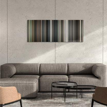 Interstellar color palette canvas on a concrete wall above a gray sectional sofa