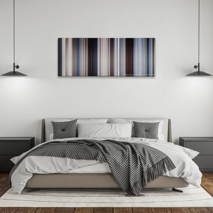 Jaws color palette canvas above a bed, between two black pendant lamps
