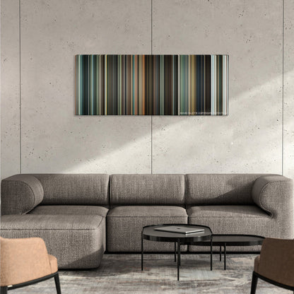 Jumper color palette canvas on a concrete wall above a gray sectional sofa