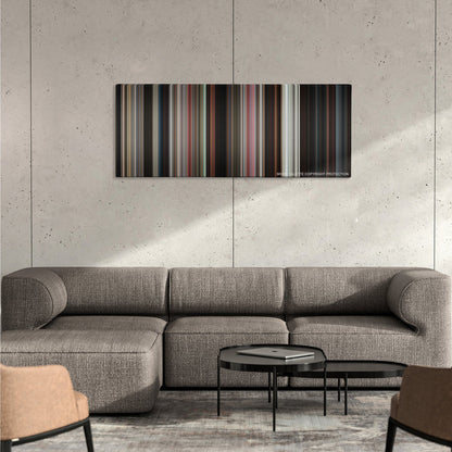 Lethal Weapon color palette canvas on a concrete wall above a gray sectional sofa
