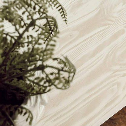 Retique It Liquid Wood 16oz bleached interior paint applied to a table, showcasing a light, natural wood finish.