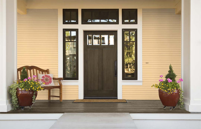 Retique It Multi-purpose Smooth Finish Kit in Charcoal for exterior wood surfaces, featuring a gloss top coat on a front door.