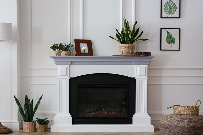 Retique It Multi-purpose Smooth Finish Kit (Med) in Vintage Blue for wood and furniture refinishing, shown on a fireplace mantle.