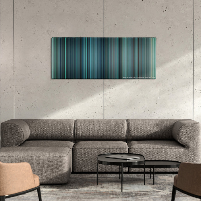 Non-Stop color palette canvas on a concrete wall above a gray sectional sofa