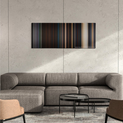 Planet of the Apes color palette canvas on a concrete wall above a gray sectional sofa
