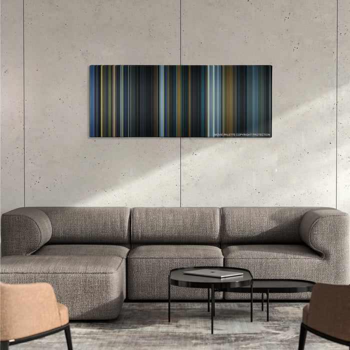 Prometheus color palette canvas on a concrete wall above a gray sectional sofa