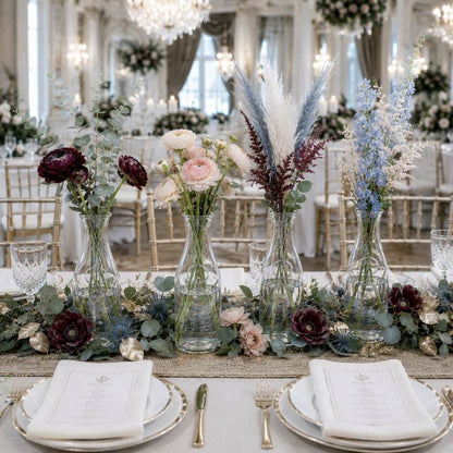 8" Milk Bottle Vase set with colorful floral arrangements on a luxury event table