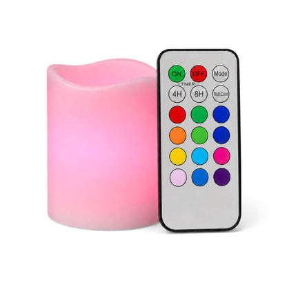 Small pink LED pillar candle with remote control on white background