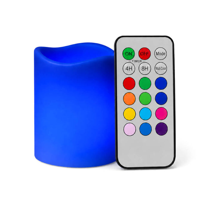 Small royal blue flameless pillar candle beside remote control