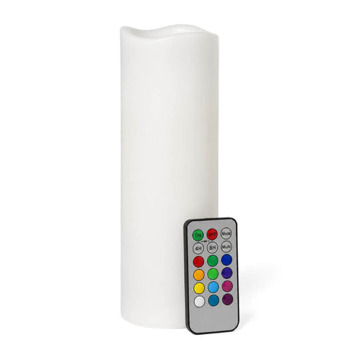 White flameless pillar candle and remote on clean white backdrop
