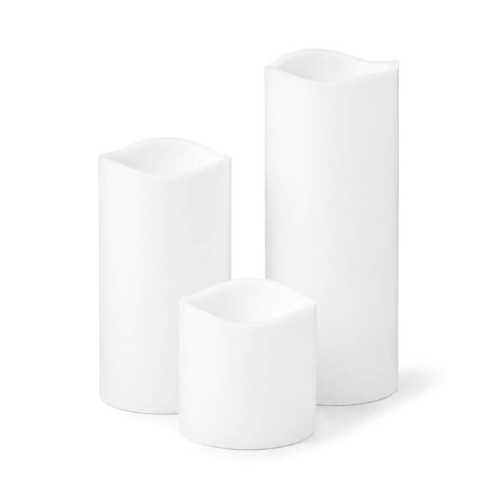 Three different size white Flameless LED Wavy Top Pillar Candles on white background