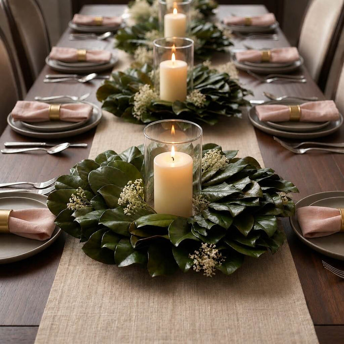 Magnolia wreaths with candles as table centerpieces