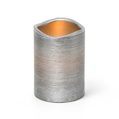 Silver Metallic Wavy Top LED Candle with warm glow on white background