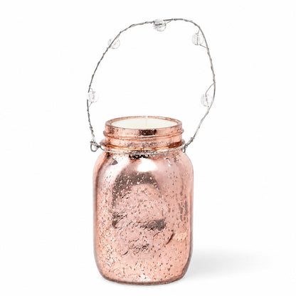 Rose gold mercury hanging mason jar with an unlit candle and bead handle