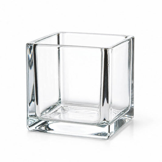 Empty 4" square glass cube vase on a white background