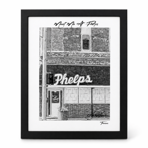Framed black and white print of a building facade with 'Phelps' sign.