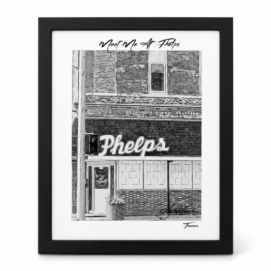 Framed black and white print of a building facade with 'Phelps' sign.